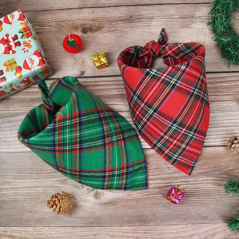 A green plaid and a red plaid Vivifying Christmas dog bandana on a wooden table
