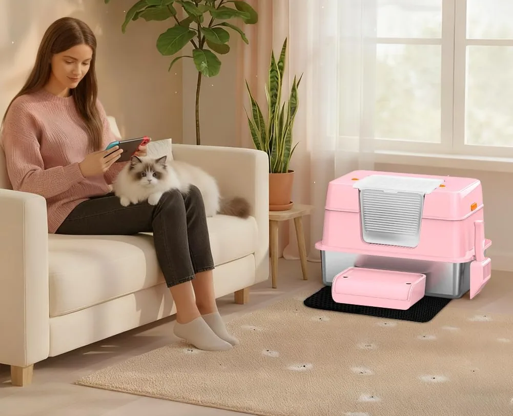 A pink Vivifying litter box with its mat and step in a living room
